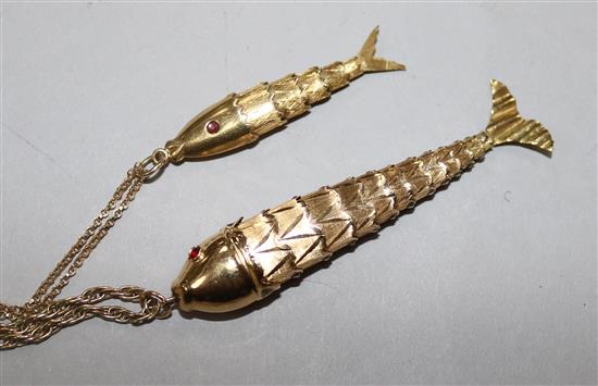 A yellow metal articulated fish pendant on chain, 12.4gr and a similar smaller fish pendant on chain, both marked 9ct, 4.1gr